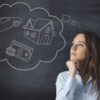 Businesswoman thinking her dreams on blackboard